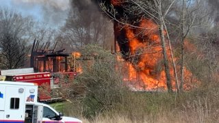 A house fire burning in Seekonk, Massachusetts, on Monday, April 21, 2025.