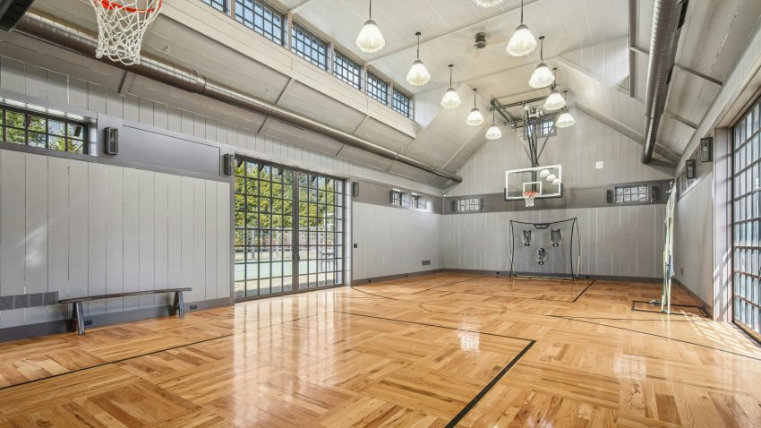 Inside the basketball court at 358 Lukes Wood Road in New Canaan, Connecticut, which features flooring from the original Boston Garden.