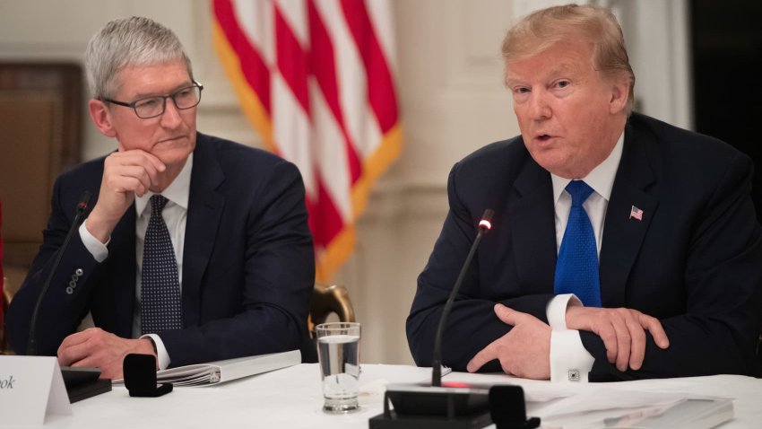 Donald Trump speaks alongside Apple CEO Tim Cook (L) during the first meeting of the American Workforce Policy Advisory Board in the State Dining Room of the White House in Washington, DC, March 6, 2019.