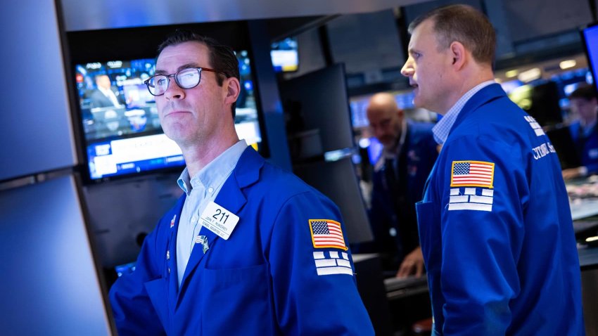 Traders work on the floor of the New York Stock Exchange on April 29, 2025.