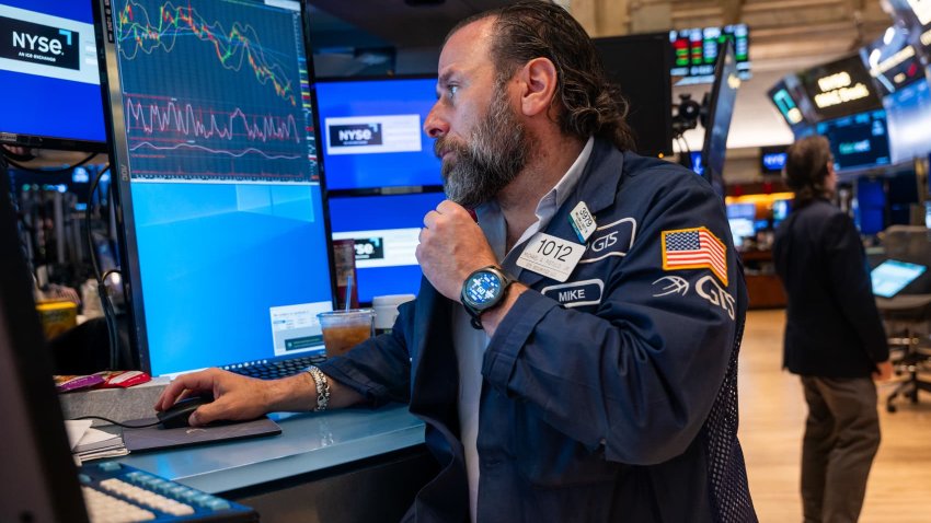 Traders work on the floor of the New York Stock Exchange (NYSE) on May 13, 2025 in New York City.