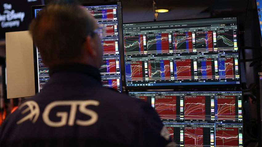 Traders work on the floor of the New York Stock Exchange (NYSE) at the opening bell on May 27, 2025, in New York City.