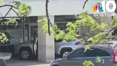 Woman accused of crashing SUV into federal building in Mass.