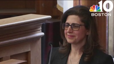 Medical examiner concludes testimony after unpleasant photos shown to jury in court