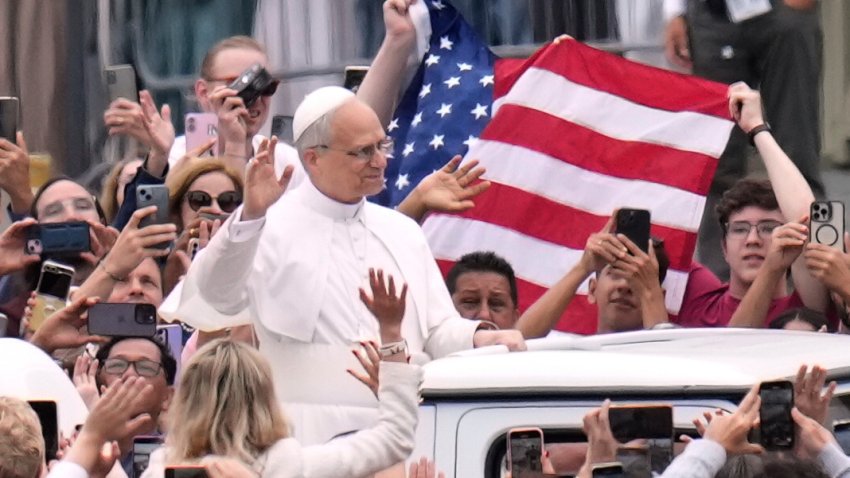 Pope Leo XIV waves as he arrives for his first weekly general audience in St. Peter’s Square at The Vatican, Wednesday, May 21, 2025. (AP Photo/Gregorio Borgia)