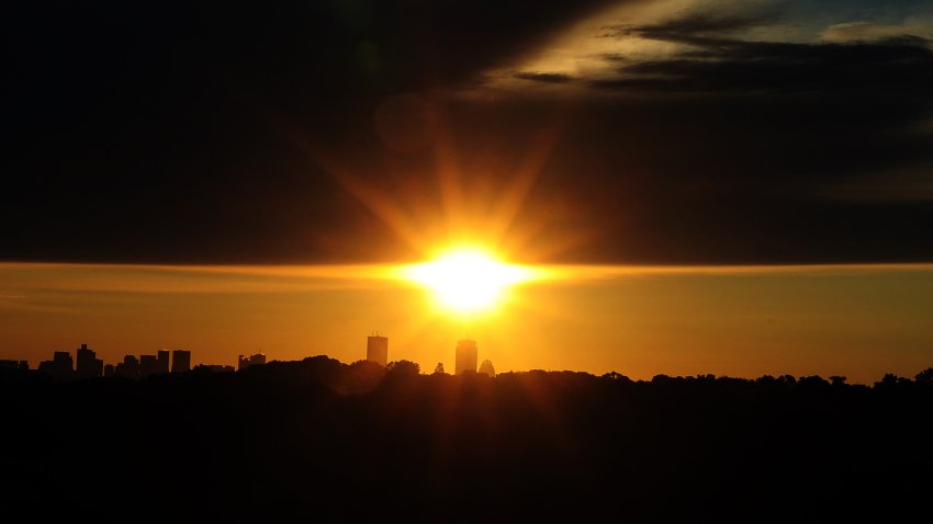The sun rises as seen from Newton, Massachusetts, on October 1, 2012. AFP PHOTO/Jewel Samad (Photo by JEWEL SAMAD / AFP) (Photo by JEWEL SAMAD/AFP via Getty Images)