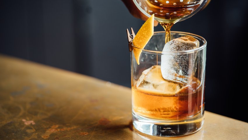 Closeup Glass with Alcohol in Cocktail Bar