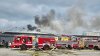 Fire sends smoke above Boston W.B. Mason warehouse
