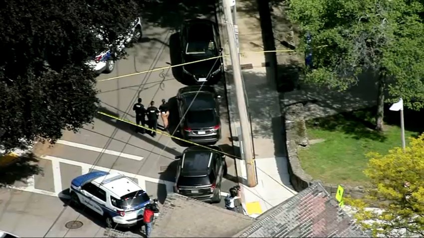 Police investigate a shooting in Boston's Roxbury neighborhood on May 13, 2025.