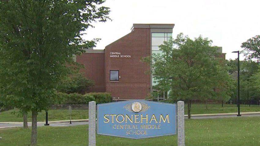 A sign reads "Stoneham Central Middle School" with a school building in the background.