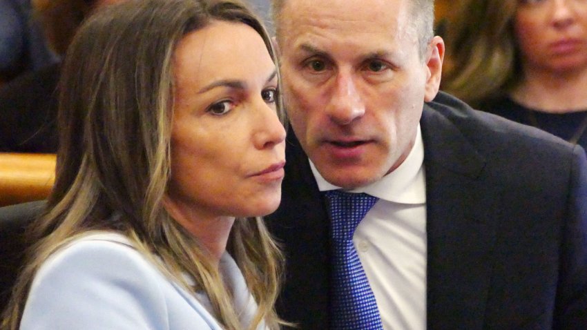 Karen Read listens to her defense attorney David Yannetti as her trial in Norfolk Superior Court in Dedham continues on Wednesday, May 14, 2025.