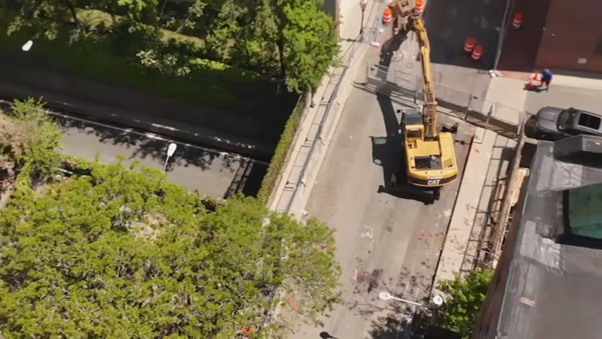 An excavator that's part of the reconstruction of a bridge over the Callahan Tunnel in Boston's North End on Monday, May 12, 2025, as the project got underway.
