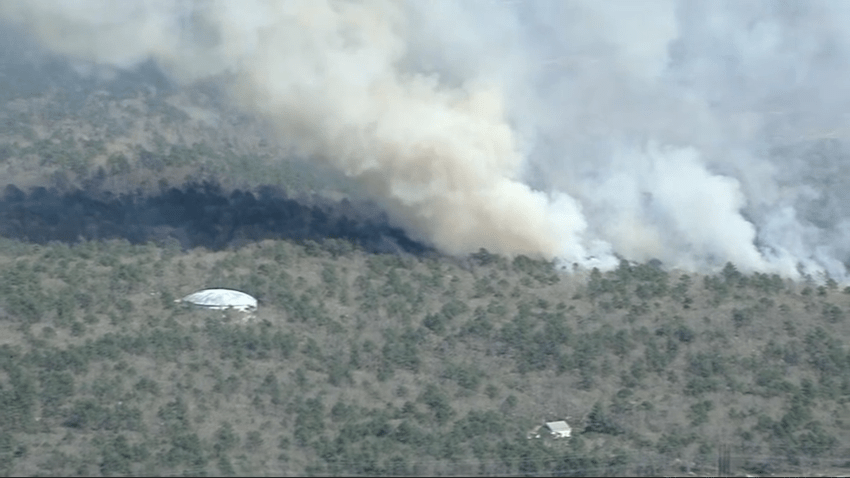 Smoke rises from a brush fire on Cape Cod on Thursday, May 1, 2025.