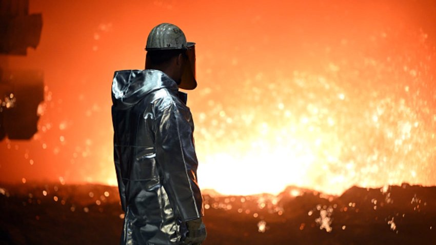 An employee stands at a blast furnace in North Rhine-Westphalia, Duisburg, Germany.