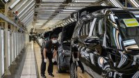 A worker checks a finished vehicle on the production line for electric vehicle maker Zeekr at its factory on May 29, 2025 in Ningbo, China.