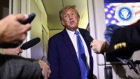 U.S. President Donald Trump speaks to reporters aboard Air Force One after departing early from the the G7 summit in Canada to return to Washington, June 17, 2025.
