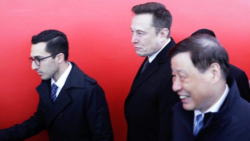 Elon Musk, chief executive officer of Tesla Inc., center left, Ying Yong, mayor of Shanghai, center right, and Omead Afshar, left, leave an event at the site of the company’s manufacturing facility in Shanghai, China, on Monday, Jan. 7, 2019.