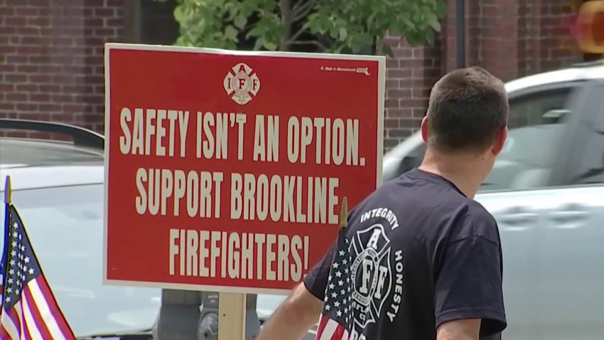 Brookline firefighters protest proposed staffing cuts to reduce overtime.