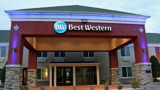 Best Western hotel showing lighted logo above entrance at dusk, The company is headquartered in Phoenix Arizona. This particular hotel is in the Tulsa, Oklahoma. (Photo by: Don and Melinda Crawford/UCG/Universal Images Group via Getty Images)