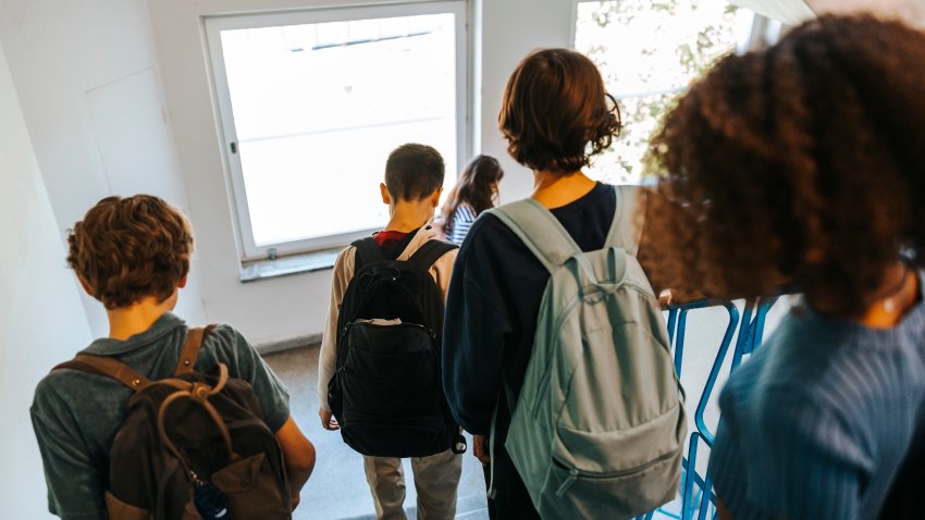 Children walking down the stairs.