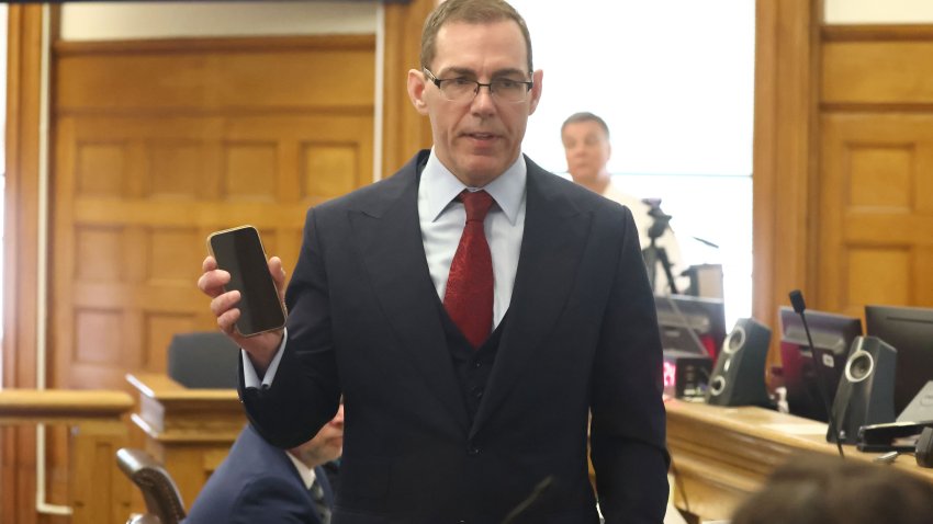 Special prosecutor Hank Brennan gives his opening argument with his cell phone at Karen Read’s second murder trial on April 22. (Staff Photo By Stuart Cahill/Boston Herald via Getty Images)