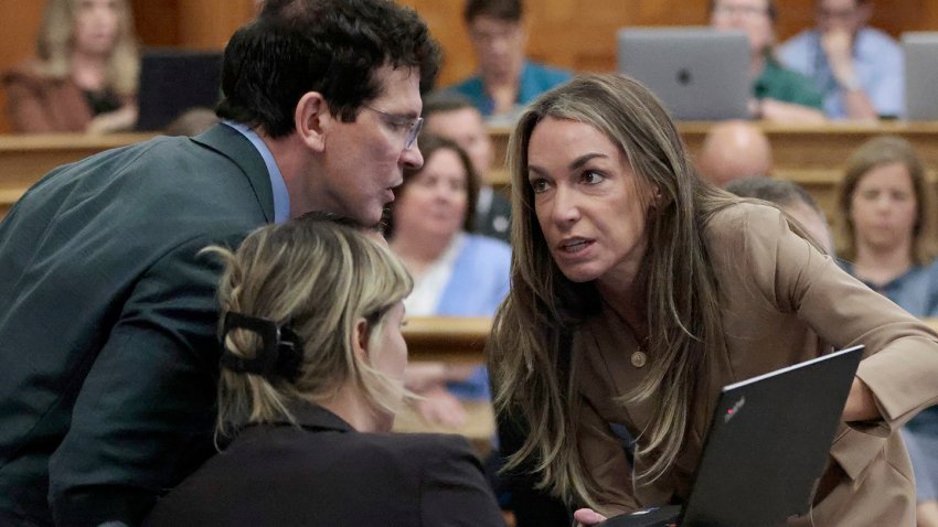 Karen Read confers with defense attorneys Robert Alessi, left, and Elizabeth Little during her murder trial on Monday, June 9, 2025.