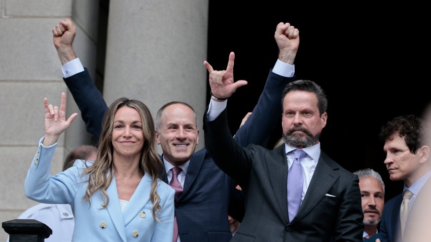 Dedham, MA – June 18: Karen Read emerges from Norfolk Superior Court on June 18, 2025 with her defense team after the jury’s verdict is announced. From left, are Read, David Yannetti, Alan Jackson, and Robert Alessi. (Photo by Lane Turner/The Boston Globe via Getty Images)