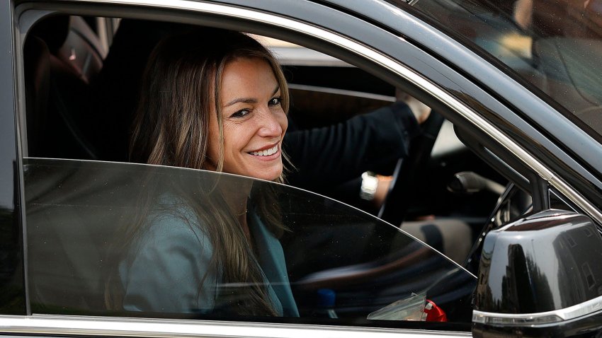 Karen Read smiles at supporters as she is driven away from Norfolk Superior Court in Dedham, Massachusetts, after a short day in her murder case on Wednesday, June 4, 2025.