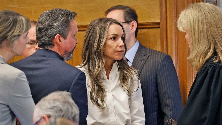 Karen Read talks with Judge Beverly Cannone when asked if she wants to take the stand in her own defense in her murder trial in Norfolk Superior Court in Dedham, Massachusetts, on Wednesday, June 11, 2025.