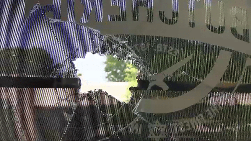 A broken window at The Butcherie in Brookline, Massachusetts, on Sunday, June 15, 2025, after a brick was thrown through it.