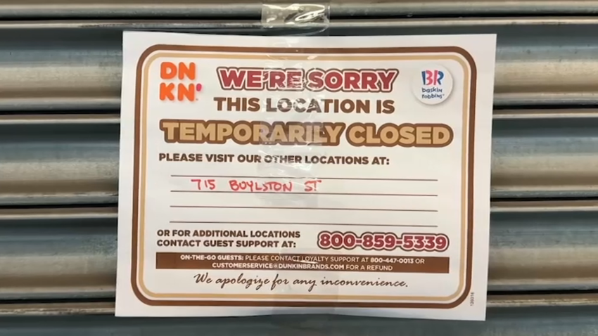 A sign outside a Dunkin' location in Boston's Back Bay saying it was closed on Tuesday, June 3, 2025.