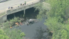 Vehicle seen in stream by I-495 in Littleton area