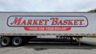 A Market Basket trailer outside the company’s headquarters and warehouse in Tewksbury. As successful as the company has been, it isn’t immune to common family-business challenges.