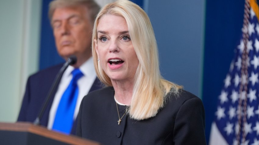 Attorney General Pam Bondi speaks to the media, Friday, June 27, 2025, in the briefing room of the White House in Washington, as President Trump looks on.