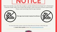 A notice indicating no swimming at beaches in Burlington, Vermont