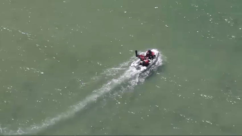 Emergency crews search the water off Old Silver Beach in Falmouth, Massachusetts, on July 29, 2025.