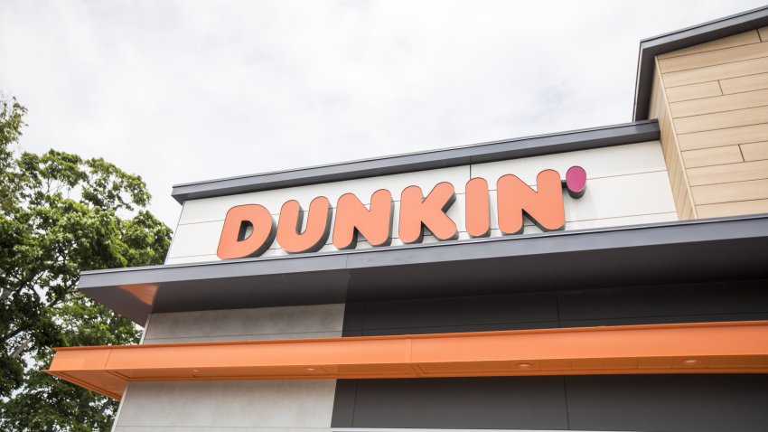 Signage is displayed on the exterior of a Dunkin’ location in Quincy, Massachusetts, U.S., on Wednesday, June 20, 2018. Dunkin’ Brands Group Inc. is scheduled to release earnings figures on February 7. Photographer: Scott Eisen/Bloomberg via Getty Images