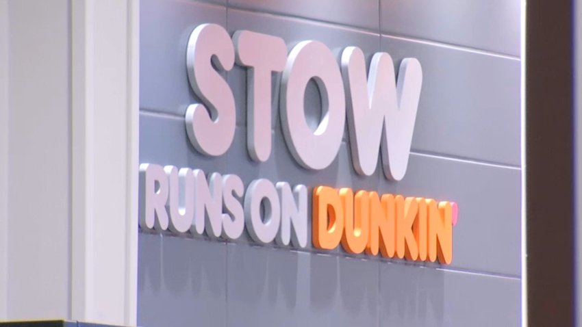 A sign that reads "STOW RUNS ON DUNKIN"