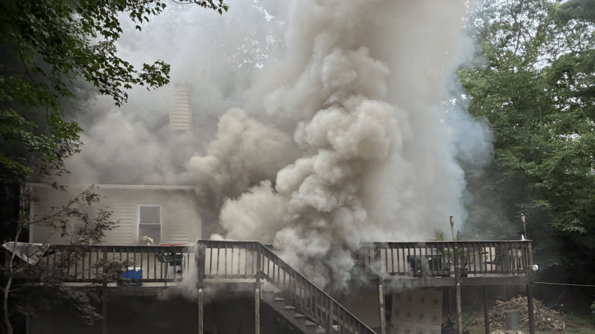 Firefighters battled a blaze at a Lakeshore Drive home in East Falmouth, Massachusetts, on Sunday, July 27, 2025.
