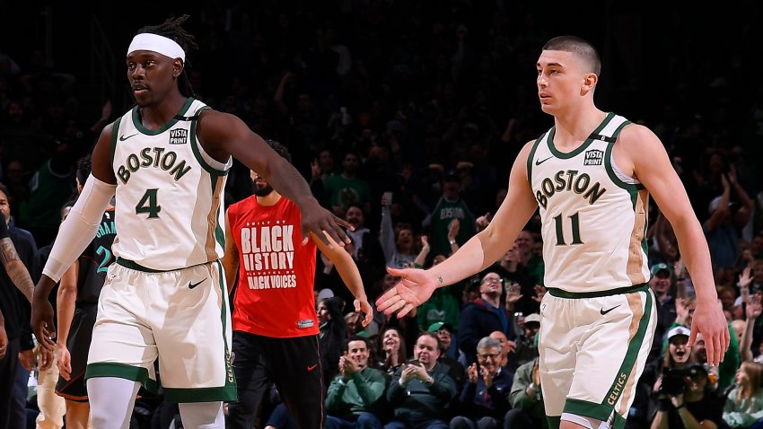 Jrue Holiday (4) and Payton Pritchard (11)