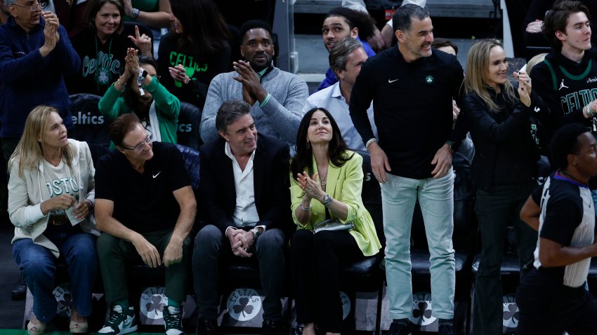 Boston Celtics co-owner Stephen Pagliuca (second from left), governor Wyc Grousbeck (third from left), and new majority owner Bill Chisholm (fifth from left)