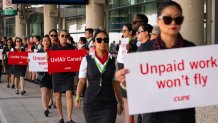 Air Canada flight attendants during a demonstration at Toronto Pearson International Airport in Mississauga, Ontario, Canada, on Monday, Aug. 11, 2025. Workers represented by the Canadian Union of Public Employees (CUPE), are holding a simultaneous action at airports in Montreal, Toronto, Vancouver, and Calgary, to raise awareness about ongoing issues related to their working conditions. Photographer: Arlyn McAdorey/Bloomberg via Getty Images