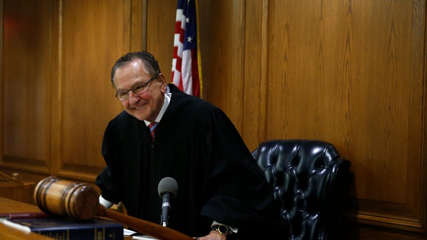 File. Judge Frank Caprio smiles as he concludes his morning session inside Municipal Court at the Providence Police Station in Providence, Ri on Oct. 30, 2017.