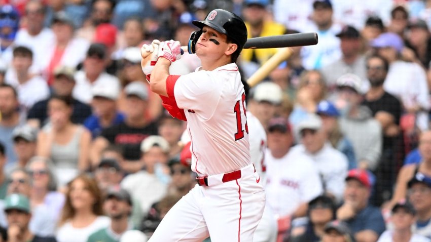 Jul 27, 2025; Boston, Massachusetts, USA; Boston Red Sox right fielder Roman Anthony (19) hits a RBI triple against the Los Angeles Dodgers during the fifth inning at Fenway Park. Mandatory Credit: Brian Fluharty-Imagn Images