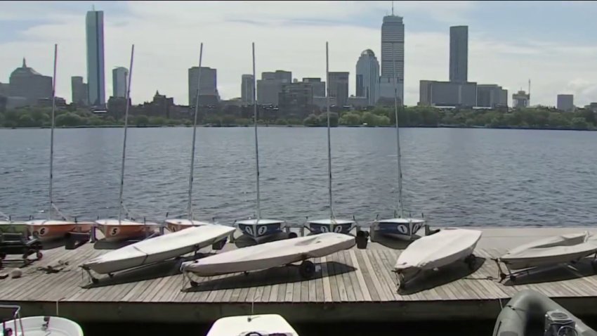 A view of a dock on the Charles River, covered in boats.