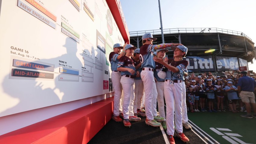 Braintree American (New England region) pitcher Frankie Fasoli III mistakenly places the teams placard in the wrong bracket after defeating Southwest (Richmond, TX )at Howard J. Lamade Stadium during the Little League Baseball World Series at South Williamsport, PA on Saturday, Aug. 16, 2025.