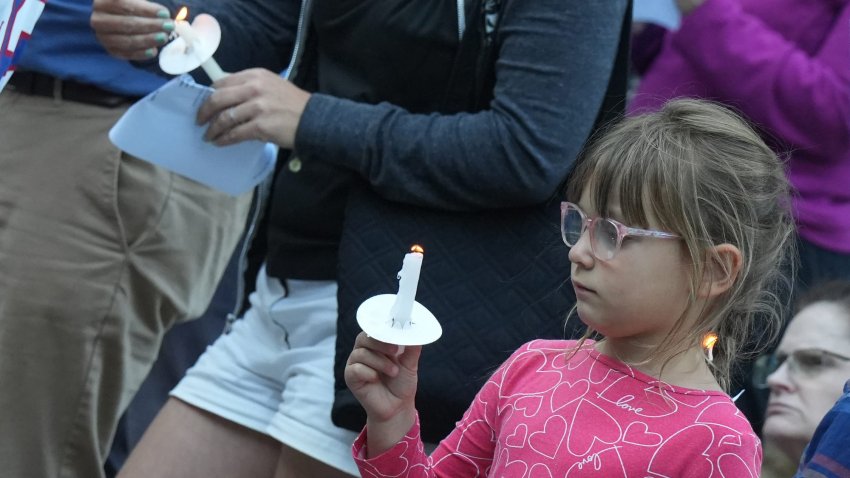 People gather at Madbury United Church of Christ Aug. 21, 2025 for a vigil to grieve the deaths of members of the Long family.