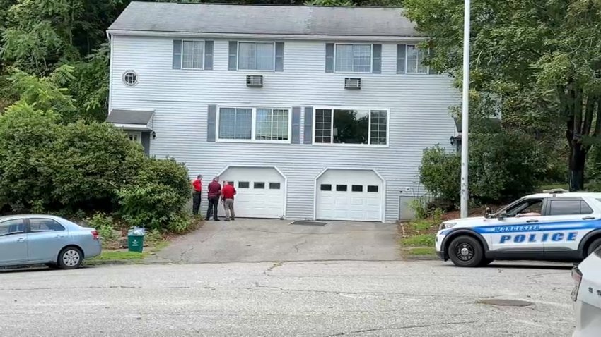 Investigators at a home in Worcester, Massachusetts, after a 2-year-old boy fell from a window.