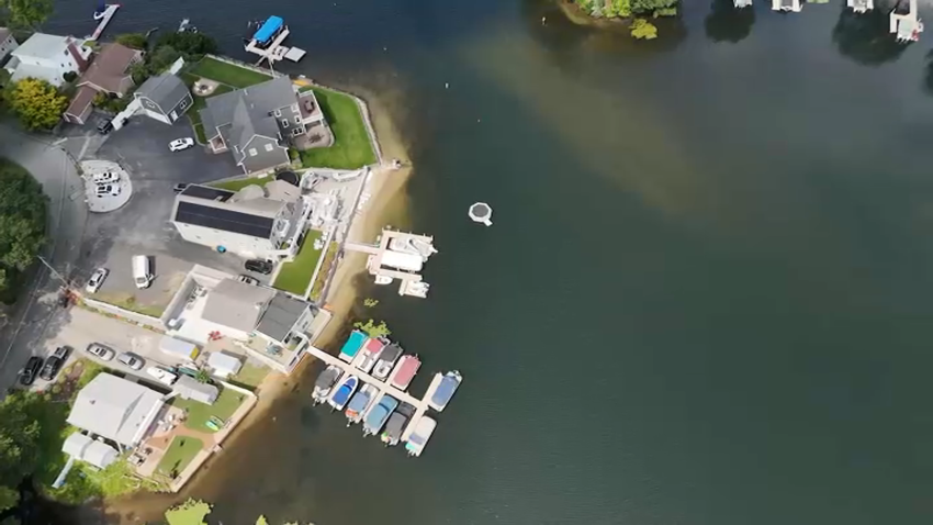 An aerial view of Massachusetts' Webster Lake while a cyanobacteria advisory was in place on Friday, Aug. 15, 2025.