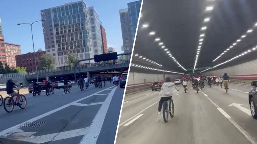 People on bicycles riding through the O'Neill Tunnel, I-93, in Boston after coming off the Zakim Bridge Saturday, Aug. 16, 2025.